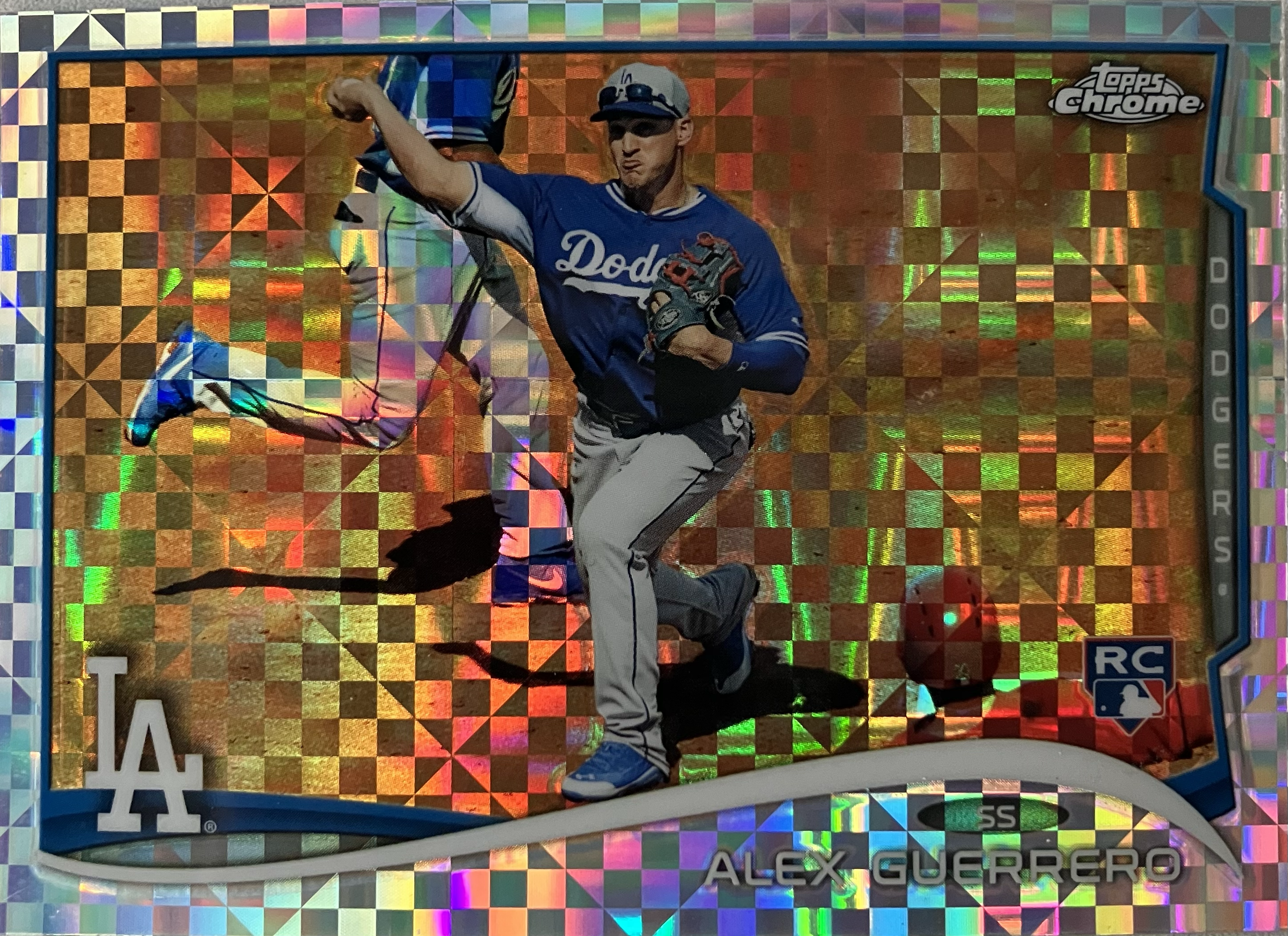 A baseball player throwing the ball to first base while a runner slides into second base.