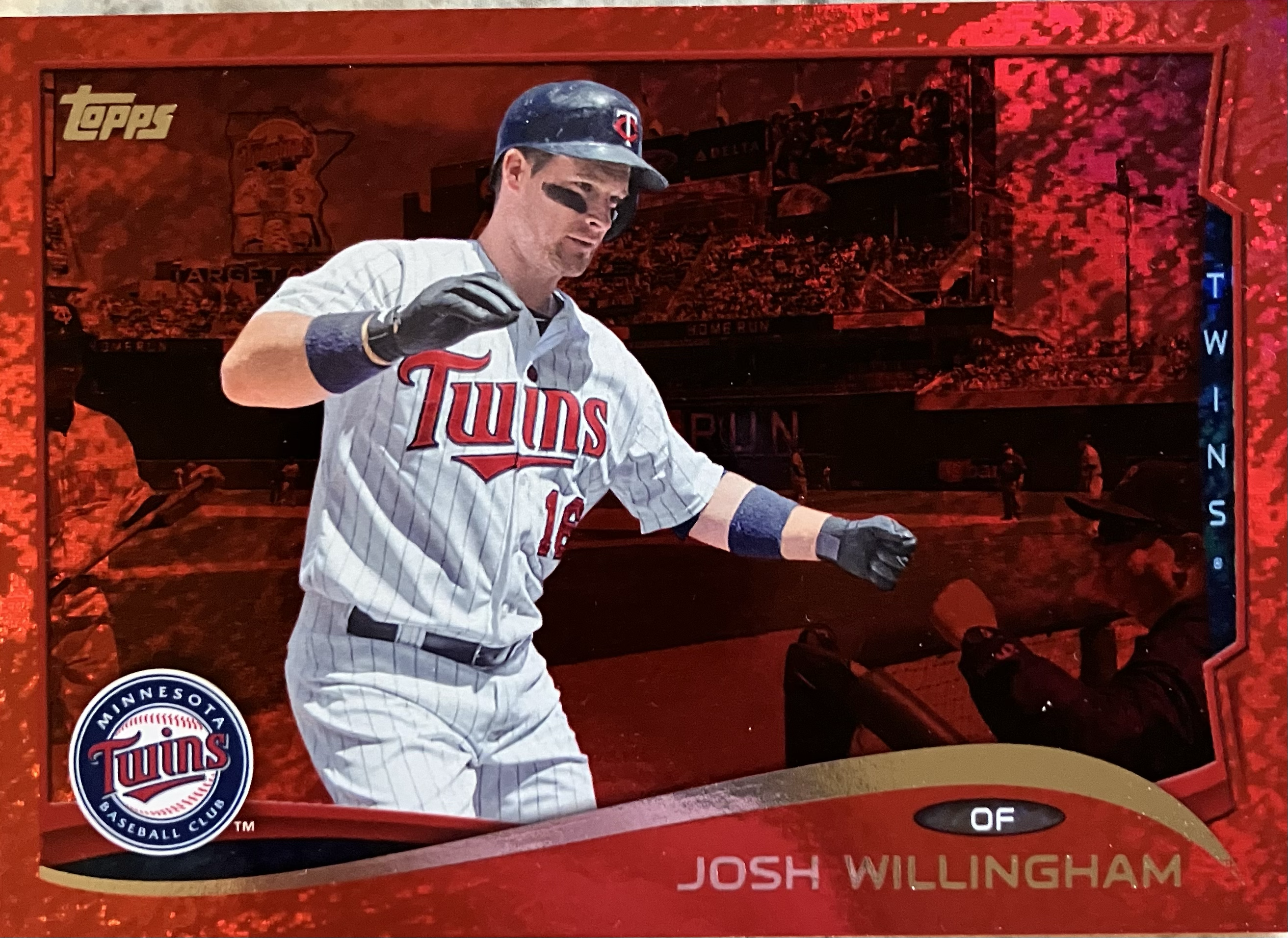 A baseball player jumping to heading into the dugout steps after hitting a home run.