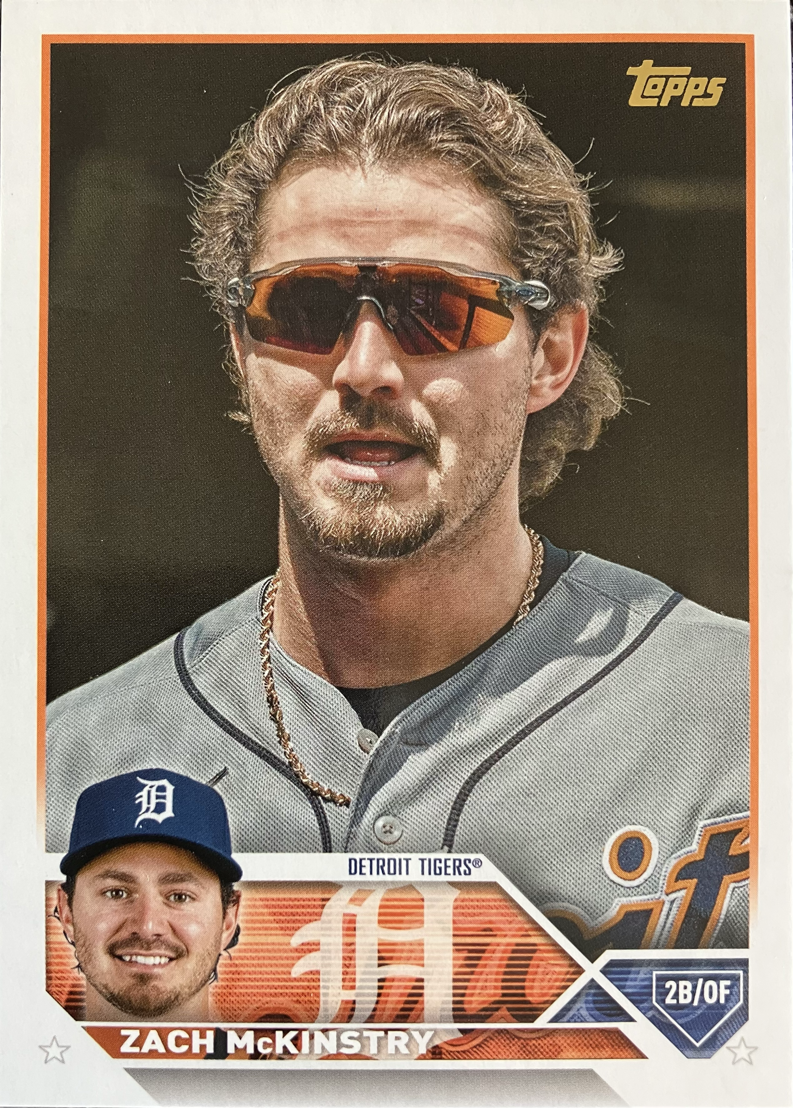 A headshot of a baseball player in the dugout.