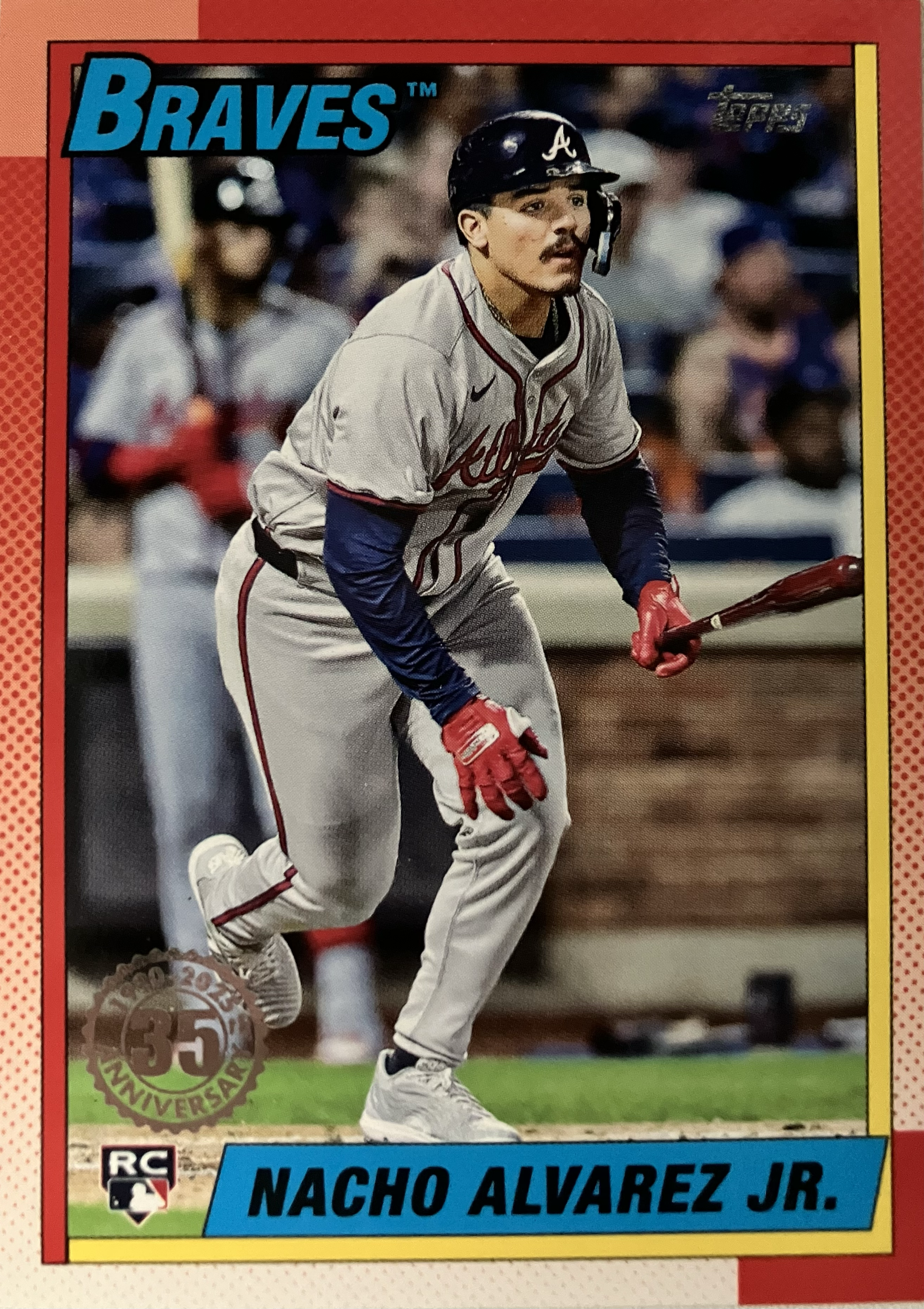 A baseball player stares into right after after just hitting a hit.