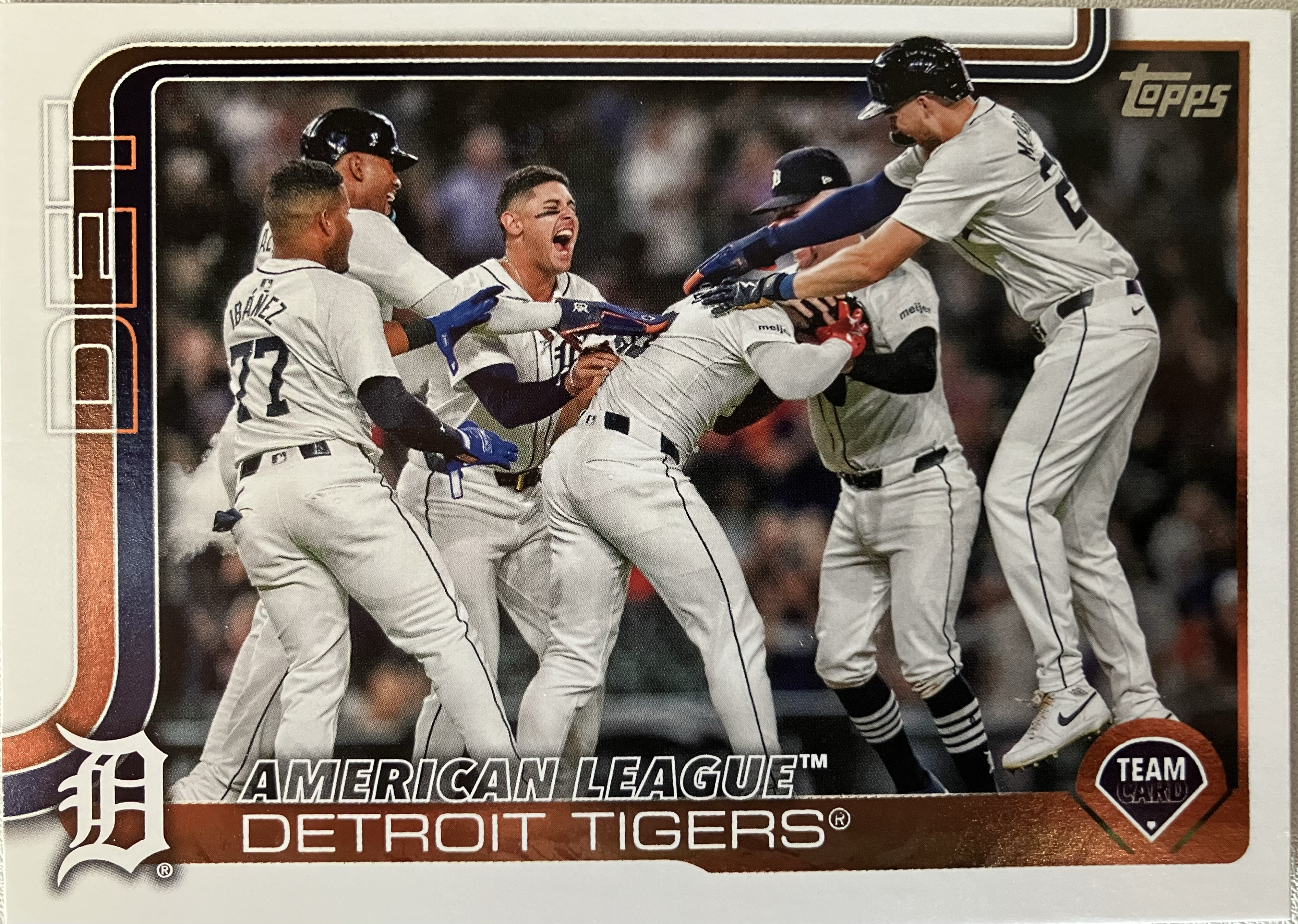 The Detroit Tigers baseball team celebrating a walkoff with several players in a large group.