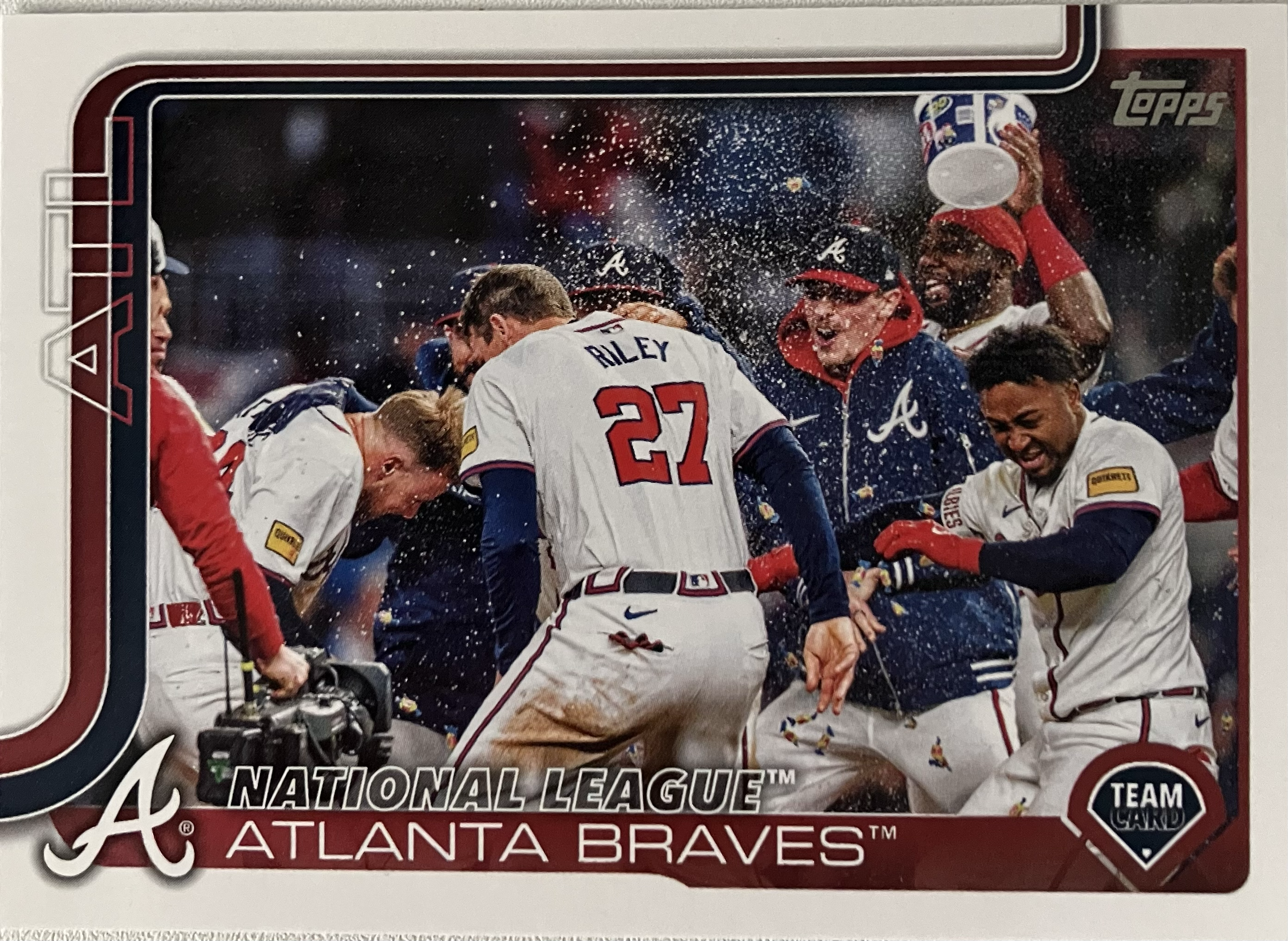 The Braves baseball team celebrating a walkoff with several players in a large group.