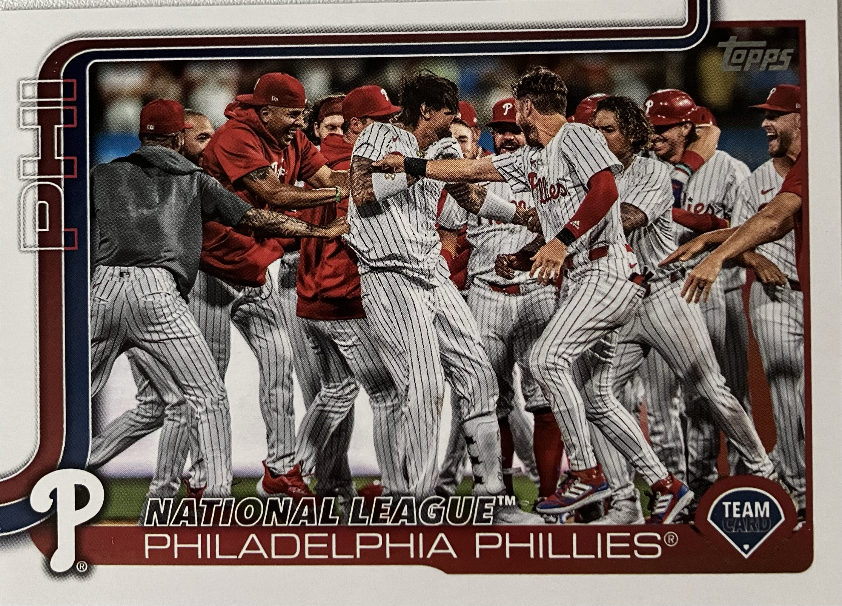 The Phillies baseball team celebrating a walkoff with several players in a large group.
