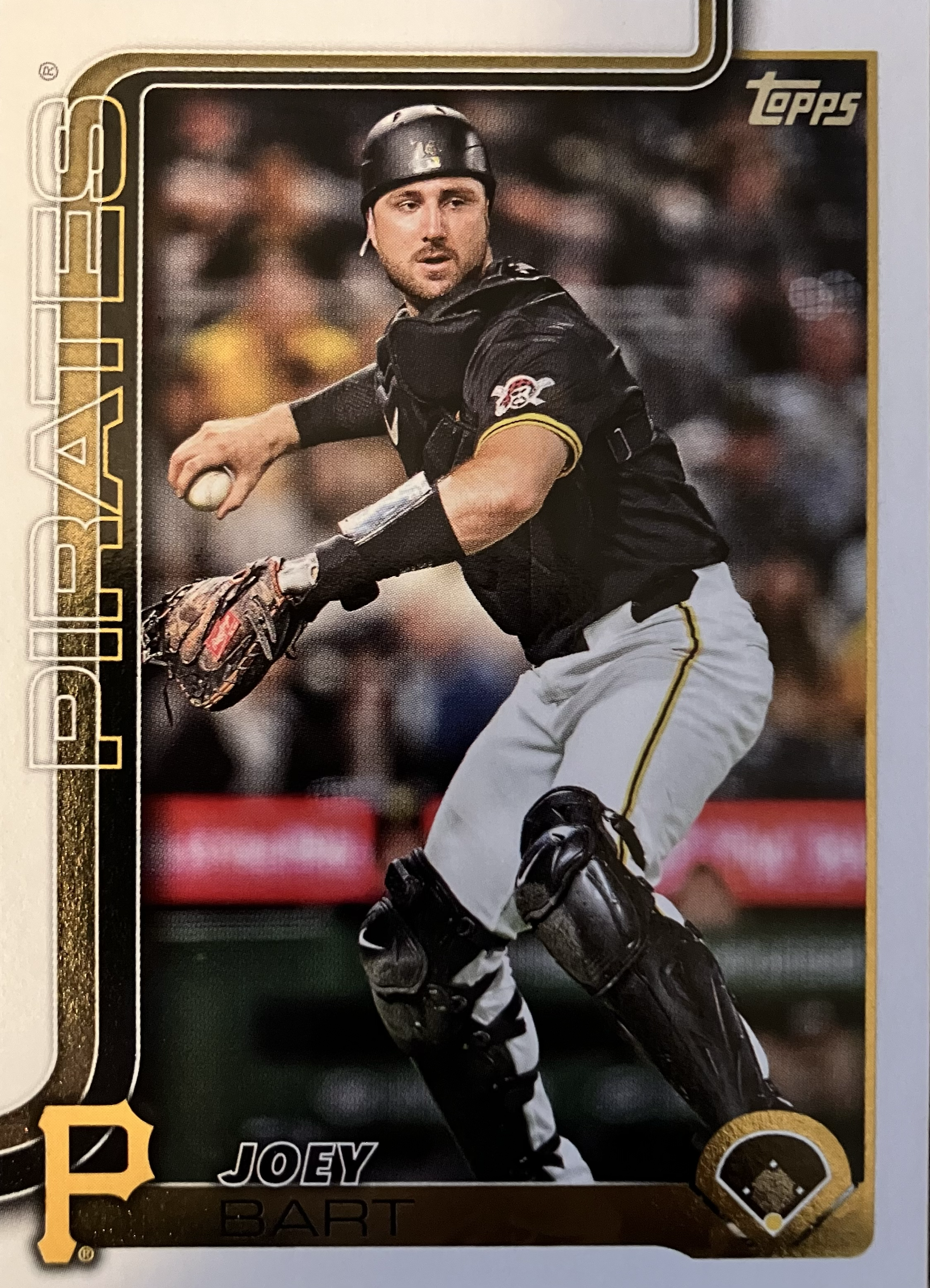 A player in catcher's gear ready to throw to first base.
