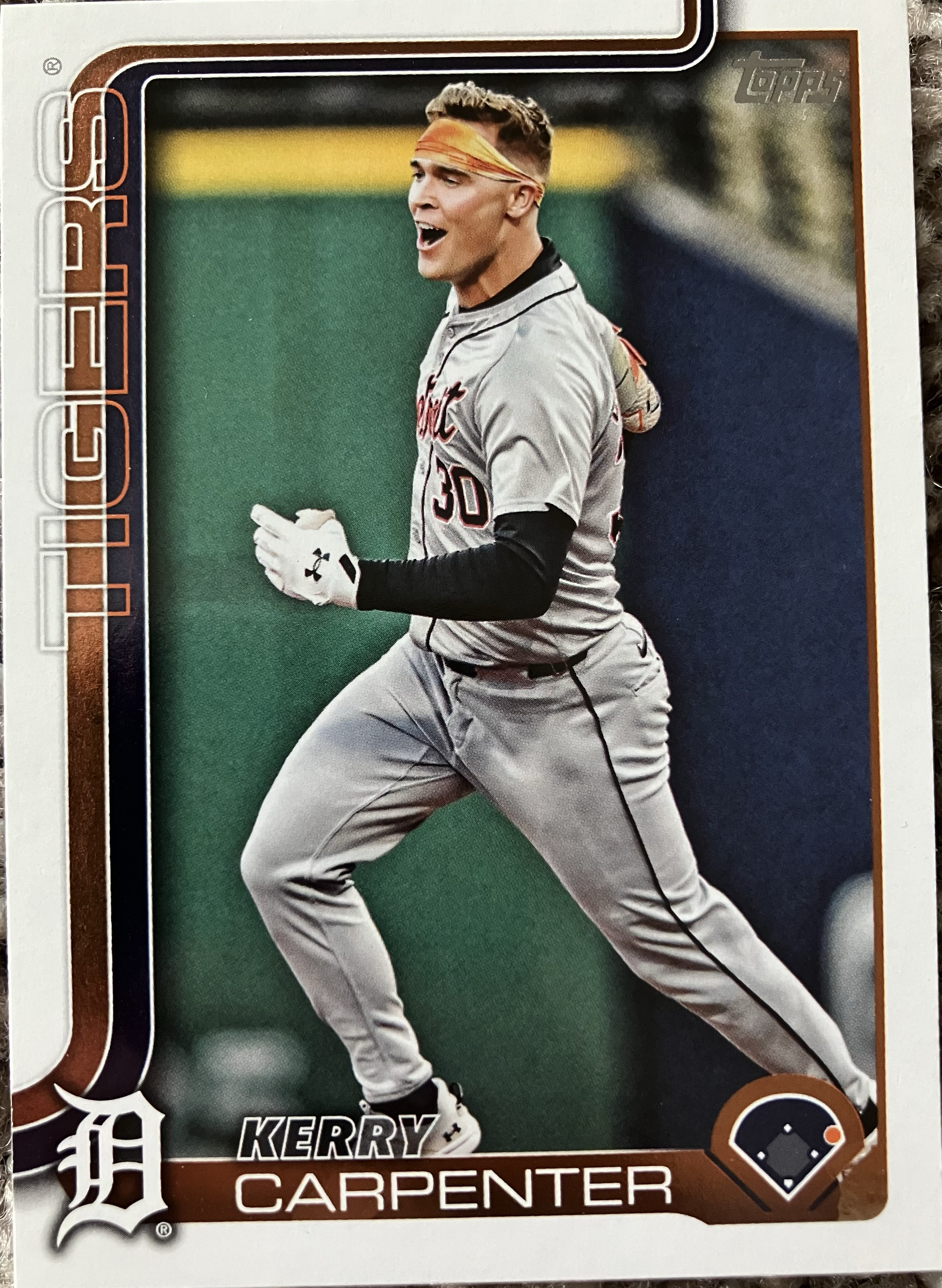 A player running around the bases in joy (with no helment).
